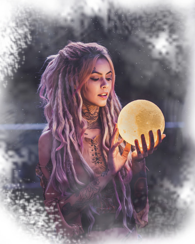 An image of a young woman staring into a crystal ball to learn what the future holds for her